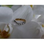 A diamond ring of V shaped set with eight round brilliant cut diamonds,