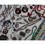 A large lot of assorted costume jewellery including Scottish hardstones, beaded necklaces,