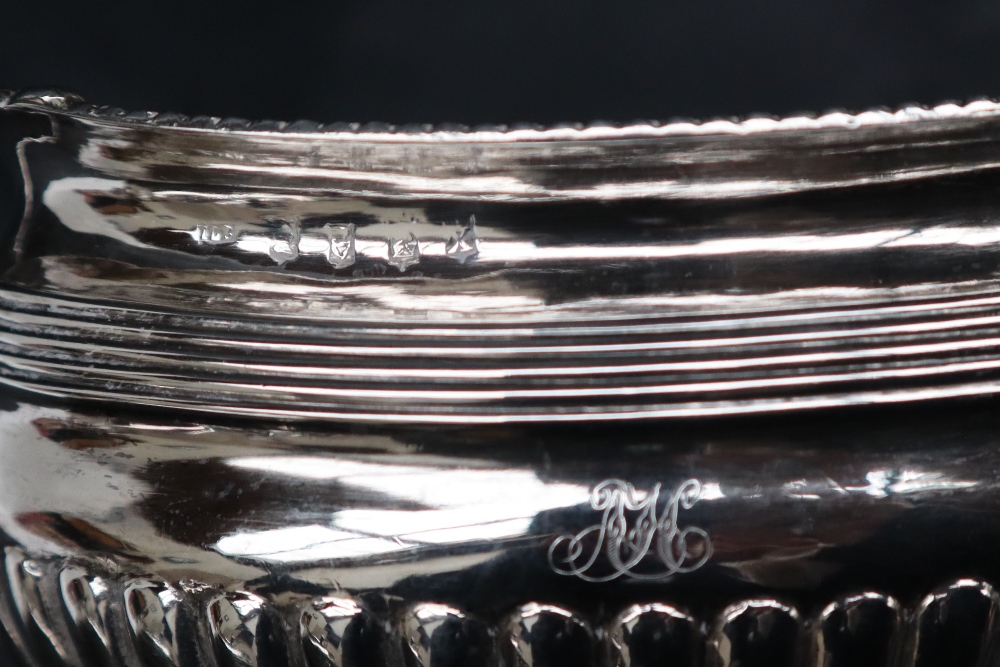 A George III Irish silver three piece tea set, - Image 7 of 9