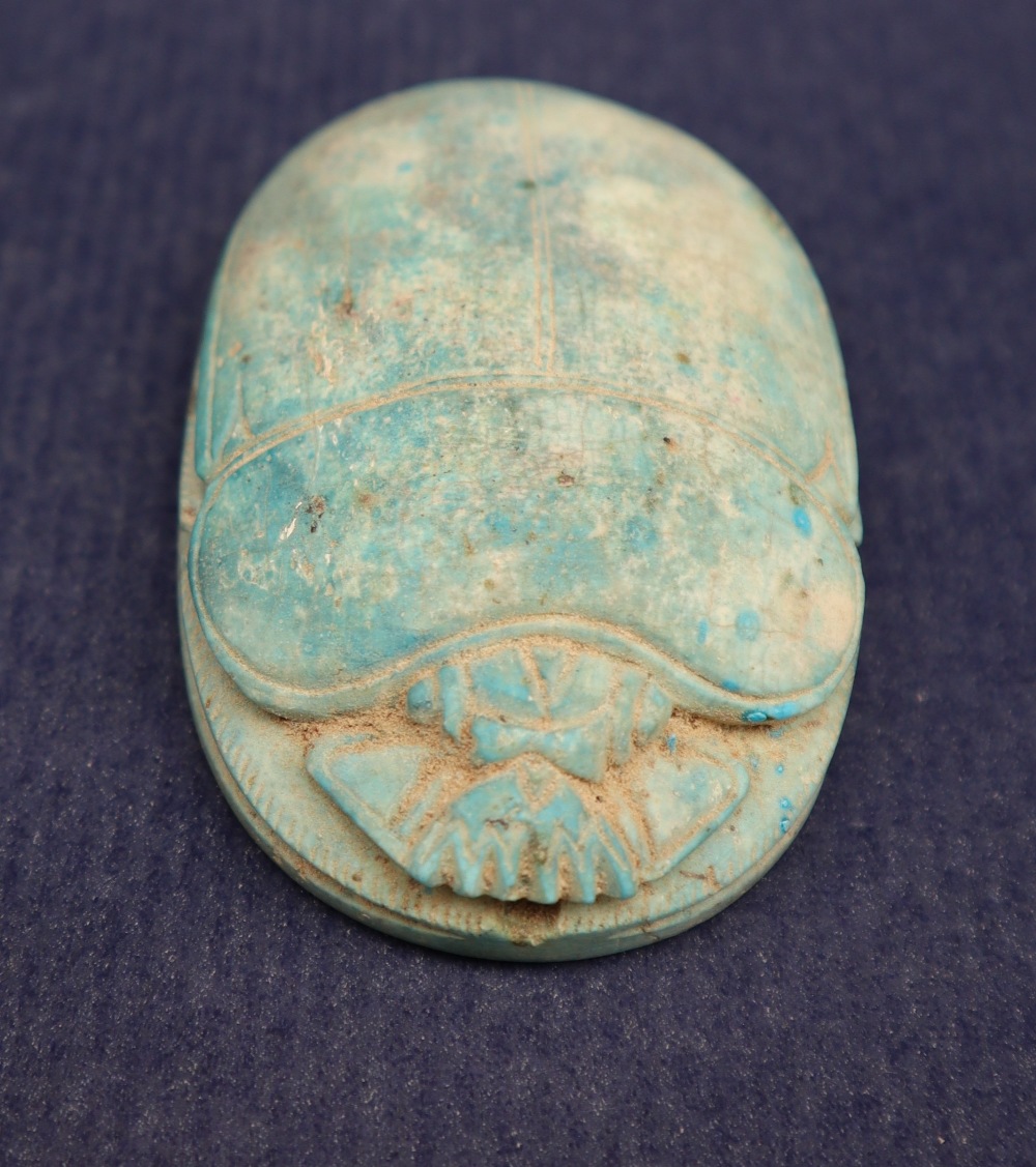 An ancient Egyptian pottery scarab beetle in turquoise, the oval base with hieroglyphics, - Image 2 of 8