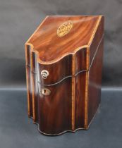 A George III mahogany serpentine fronted knife box with a shell inlaid crossbanded top,