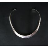 A silver torque necklet together with silver bangles,