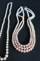A pearl necklace with graduated pearls, ranging from 6mm to 3mm diameter, to a 9ct white gold clasp,