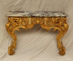 A marble topped console table with a shaped top,