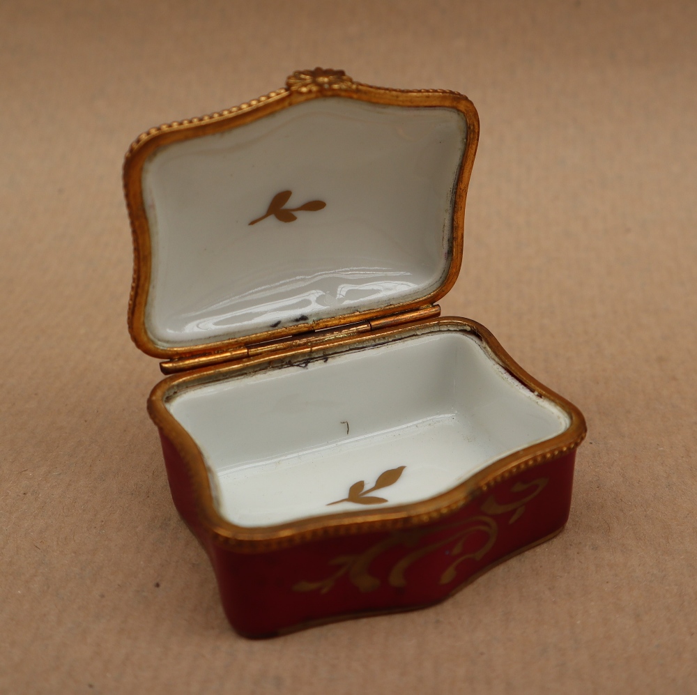 A 19th century porcelain box and cover painted with flowers to the lid and a rose pink border with - Image 5 of 7