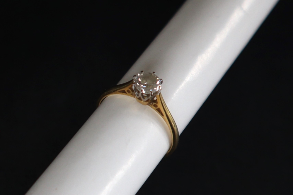 A solitaire diamond ring, set with a round brilliant cut diamond, approximately 0.