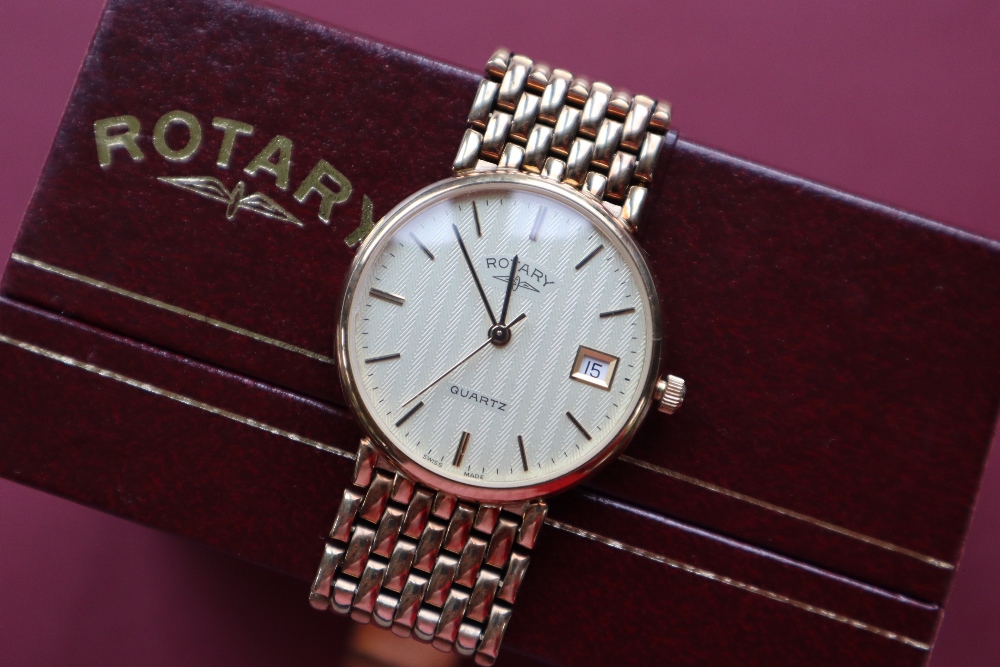 A 9ct gold Rotary wristwatch with a silvered dial and batons with a date aperture at 3 on a 9ct