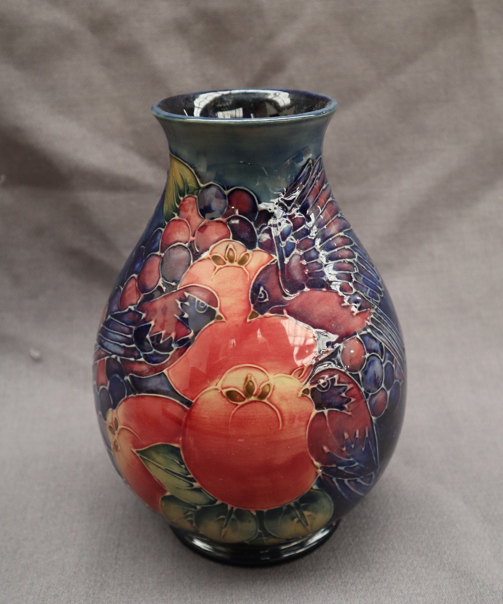 A Moorcroft pottery vase decorated with birds and fruit to a royal blue ground, - Image 2 of 9