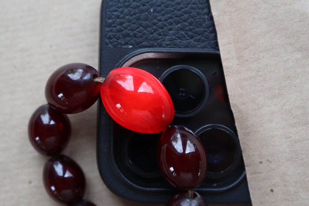 A Cherry amber / bakelite bead necklaces, with oval beads ranging in size from, 23mm to 8mm, - Image 5 of 14