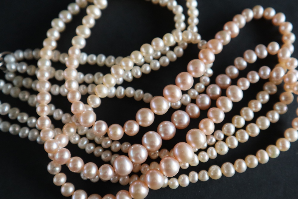 A pearl necklace with graduated pearls, ranging from 6mm to 3mm diameter, to a 9ct white gold clasp, - Image 5 of 5