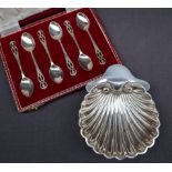 A Late Victorian silver shell shaped bon bon dish, on three ball feet, London, 1895,