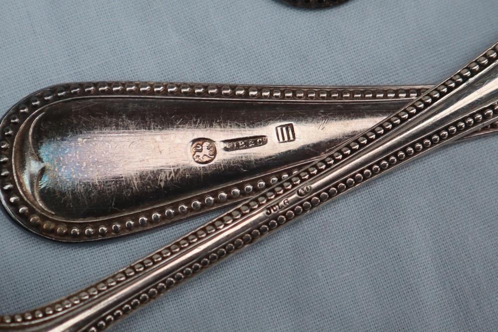 A continental white metal bead decorated part flatware service comprising nine table spoons, - Image 5 of 5