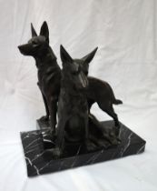 In the style of Plagnet Two German Shepherds On a veined marble base Bears a signature 42cm high x