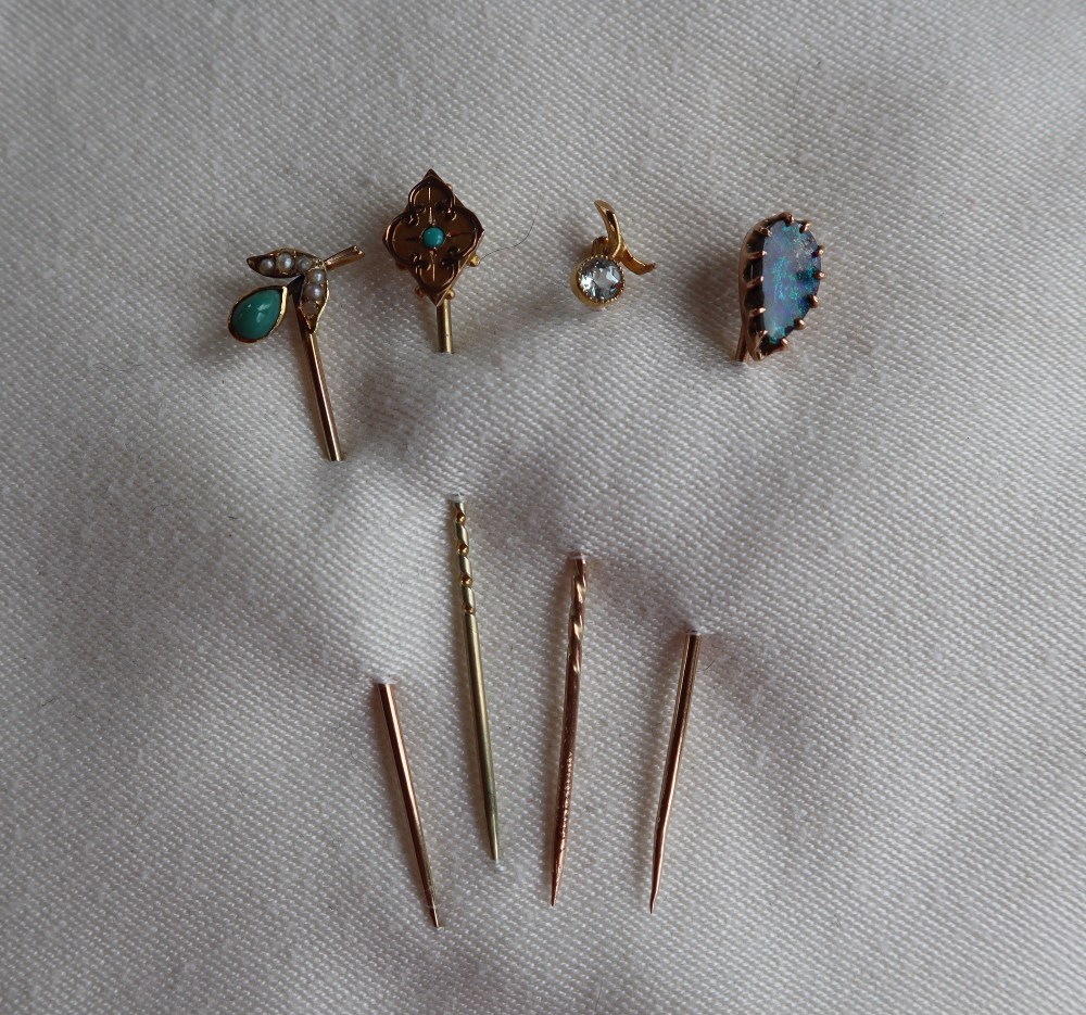 A black opal stick pin to a 9ct yellow gold setting and pin together with a 9ct gold turquoise set