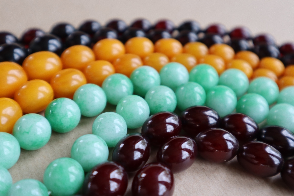 A Cherry amber / bakelite bead necklaces, with oval beads ranging in size from, 23mm to 8mm, - Image 3 of 14