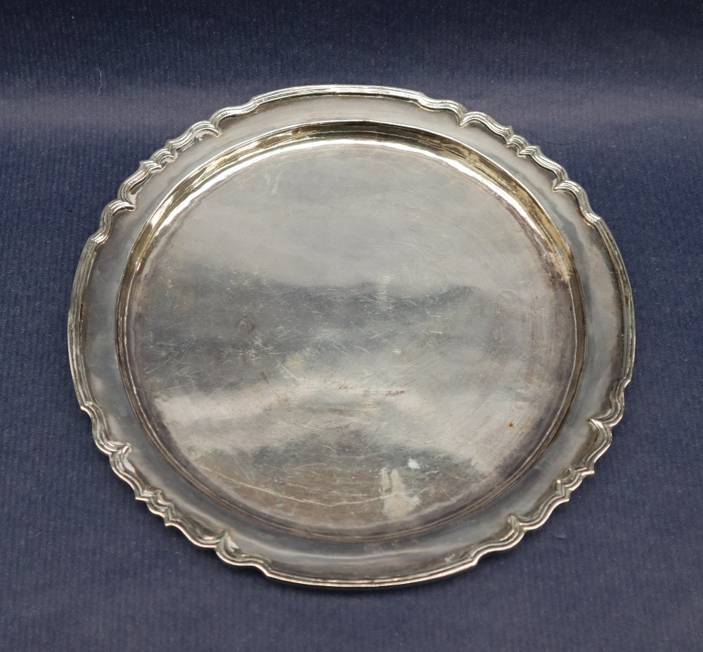 An Elizabeth II silver waiter with a wavy rim, London, 1973, 20cm diameter,