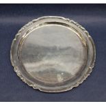 An Elizabeth II silver waiter with a wavy rim, London, 1973, 20cm diameter,