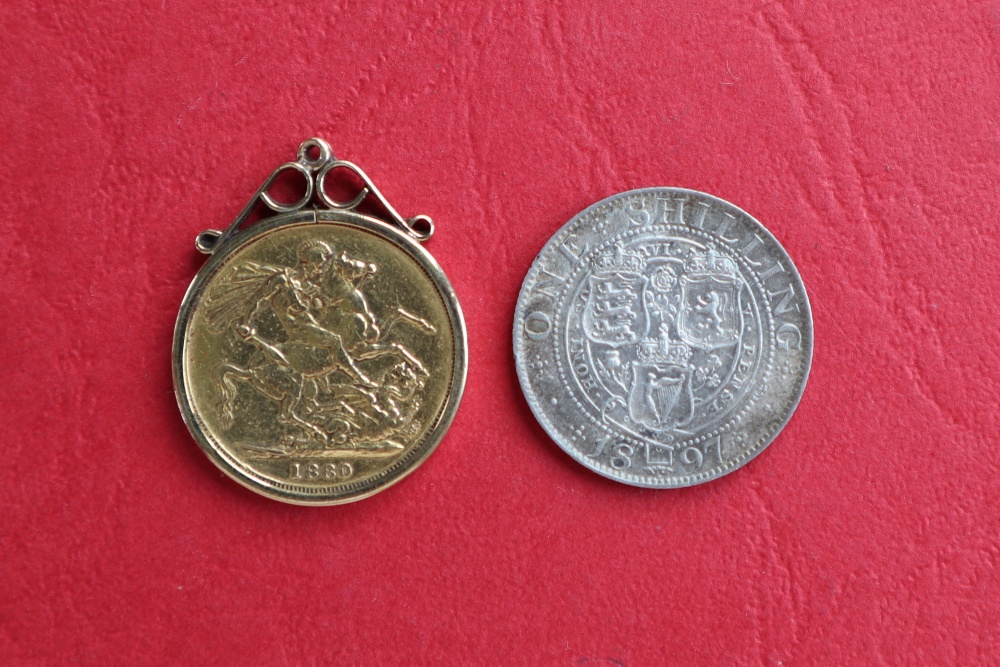 A Victorian young head sovereign, dated 1880 in a 9ct gold slip mount, - Image 2 of 2