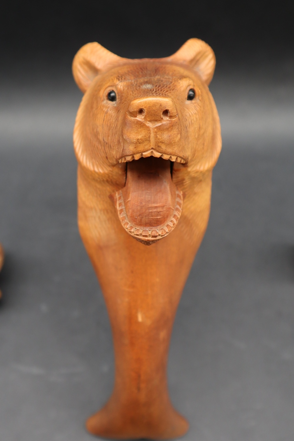 A Black Forest carved Bear lever nut cracker together with two carved bear topped bottle stops, - Image 9 of 9