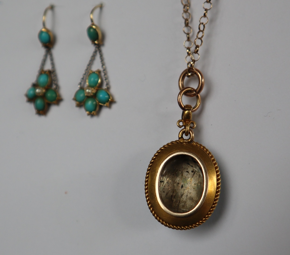 A yellow metal pendant of oval form set with turquoise on a 9ct yellow gold chain, - Image 4 of 5