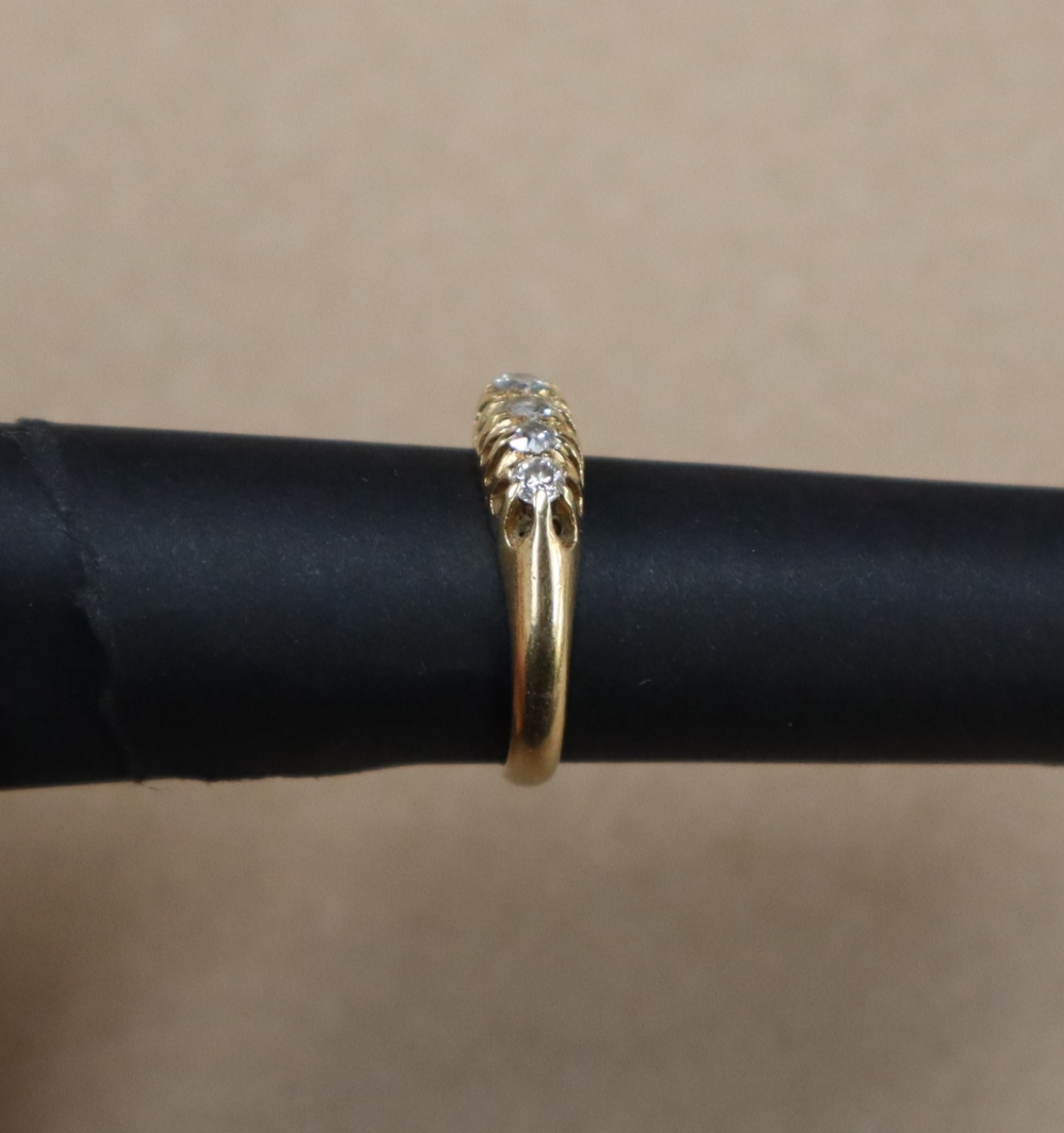 An 18ct yellow gold ring set with five graduated old cut diamonds, size K, approximately 3. - Image 2 of 4