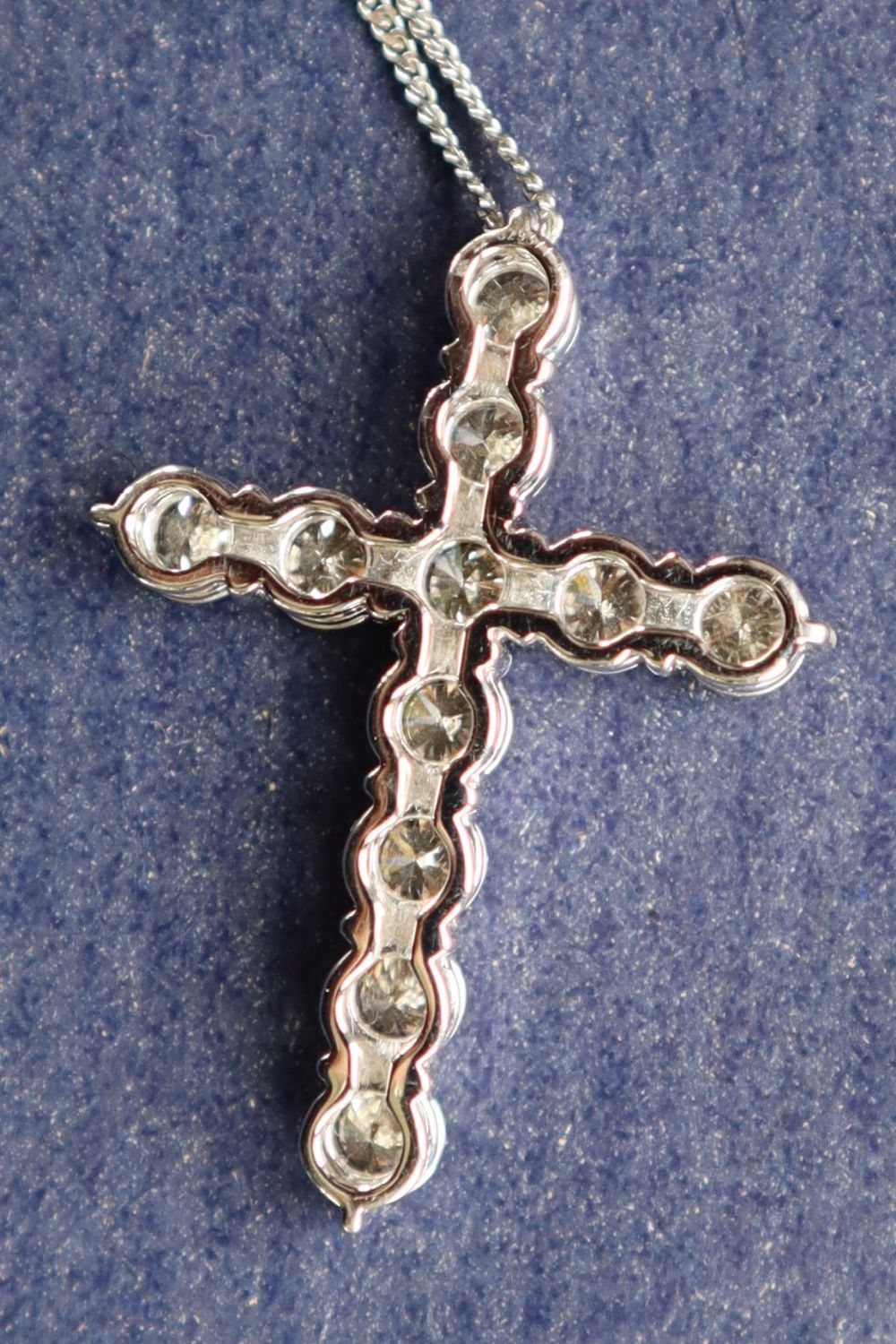 A diamond crucifix set with eleven round brilliant cut diamonds totalling approximately 2.41cts. - Image 5 of 5