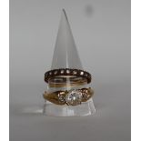 A 14ct gold dress ring set with a round faceted cubic zirconium, size U 1/2, approximately 3.