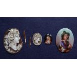 A shell cameo of oval form depicting a bacchanalian head in profile together with another small