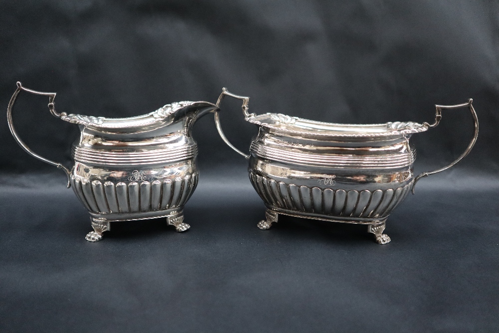 A George III Irish silver three piece tea set, - Image 6 of 9