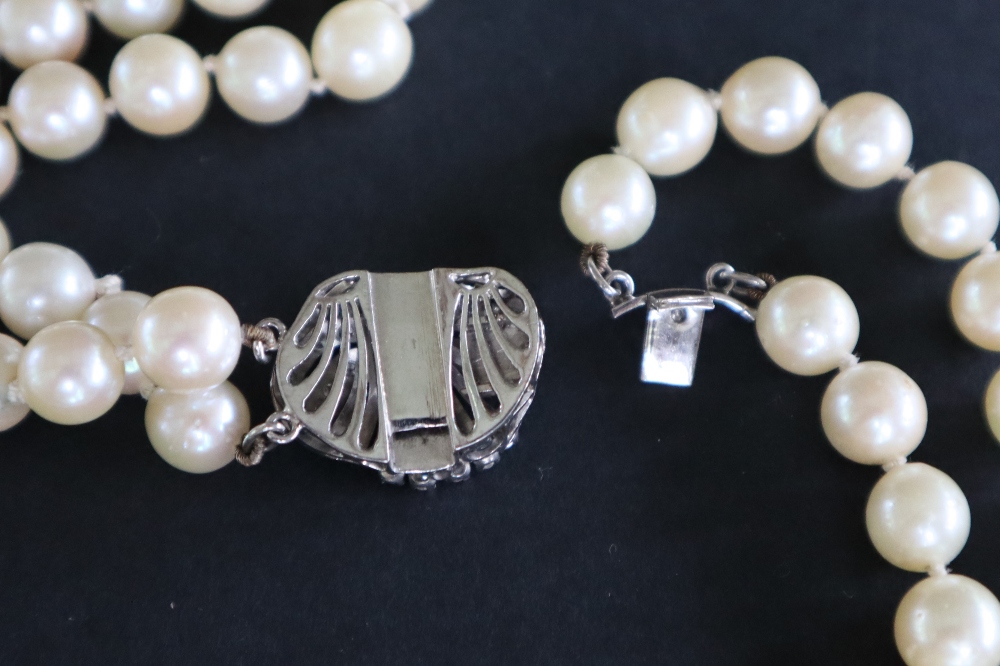 A double strand pearl necklace set with one hundred and twenty one regular pearls to a white metal - Image 3 of 5