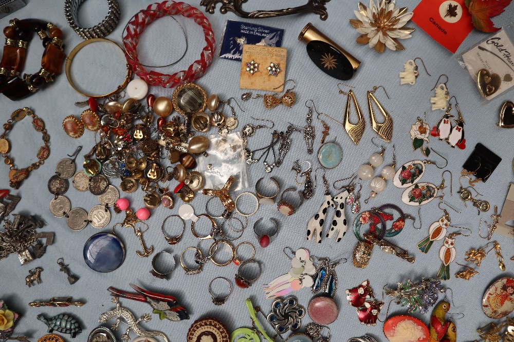 A large collection of costume jewellery including earrings, faux pearl necklaces, rings, medallions, - Image 5 of 7