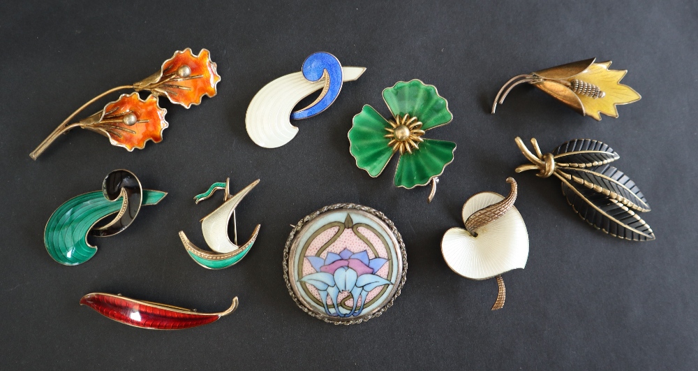 A collection of Norwegian silver and enamel brooches including Albert Scharning and others together