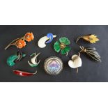 A collection of Norwegian silver and enamel brooches including Albert Scharning and others together