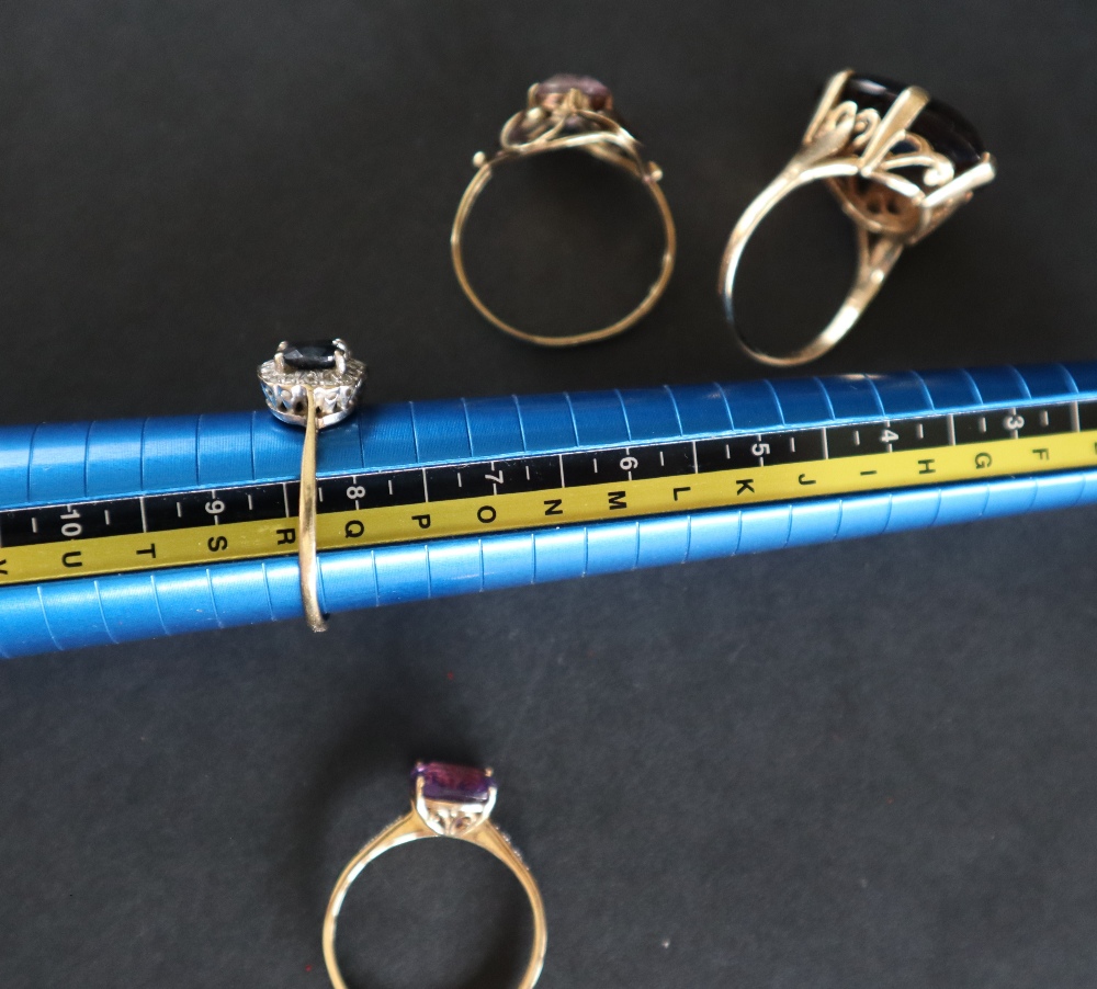 A 9ct yellow gold amethyst set dress ring together with two other 9ct gold rings another ring and - Image 6 of 8