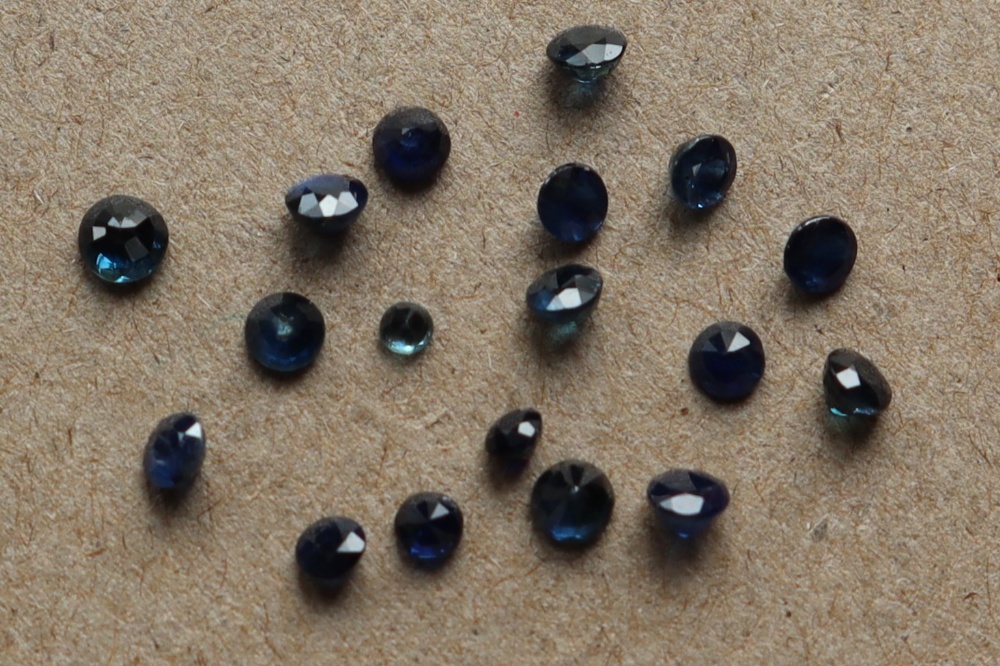 A collection of unmounted mixed round-cut sapphires totalling approximately 2. - Image 2 of 3