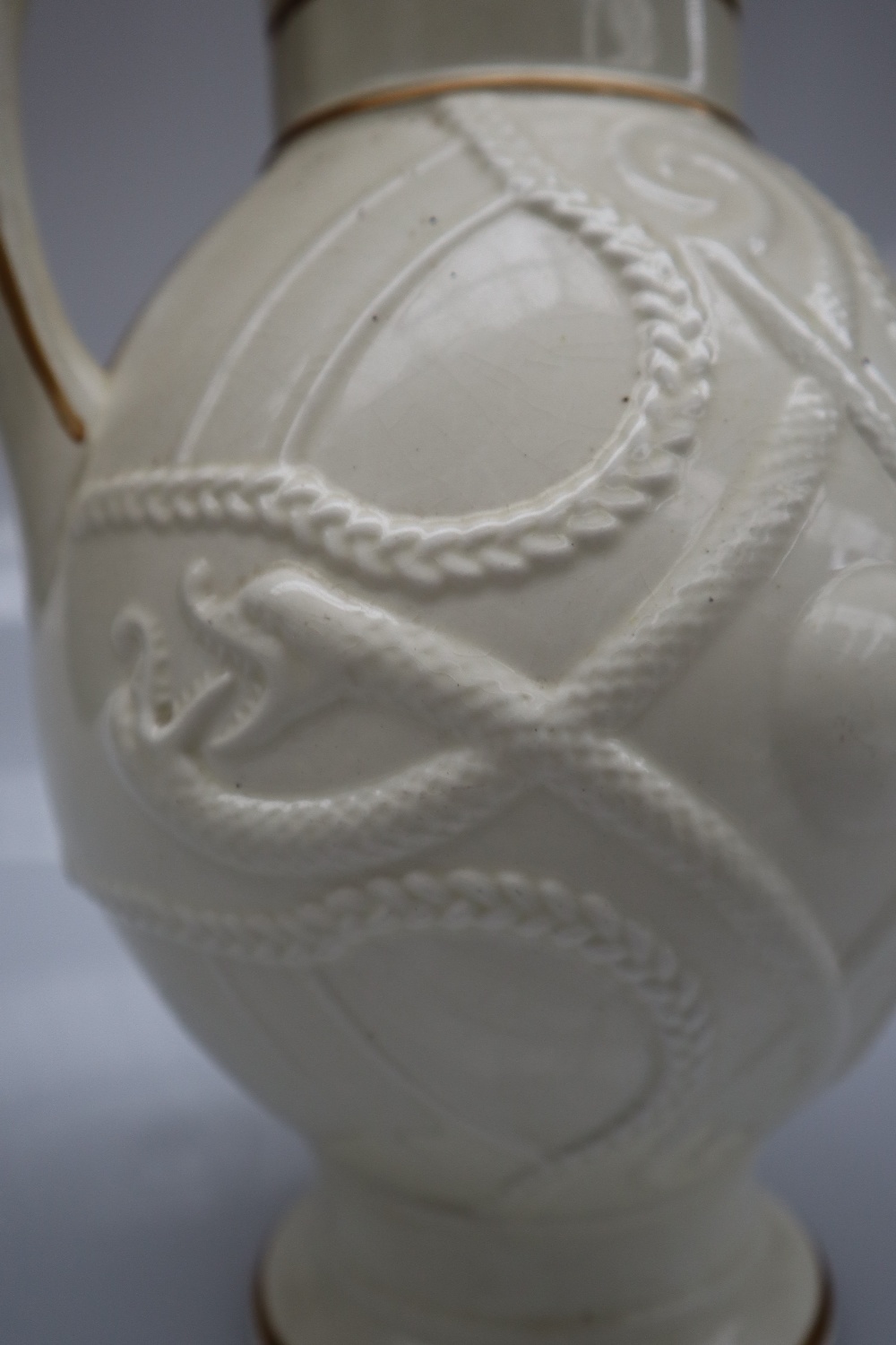 A Victorian pottery creamware jug with a cylindrical neck and bulbous body decorated with serpents - Image 3 of 6