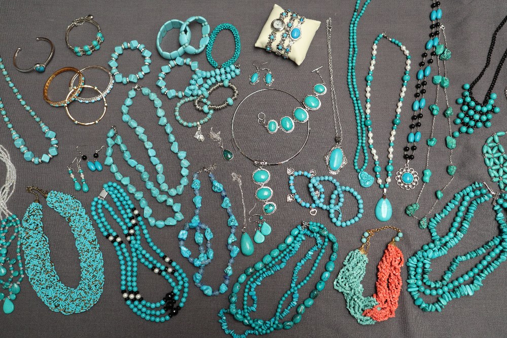 Turquoise beaded necklaces together with turquoise set bracelets,