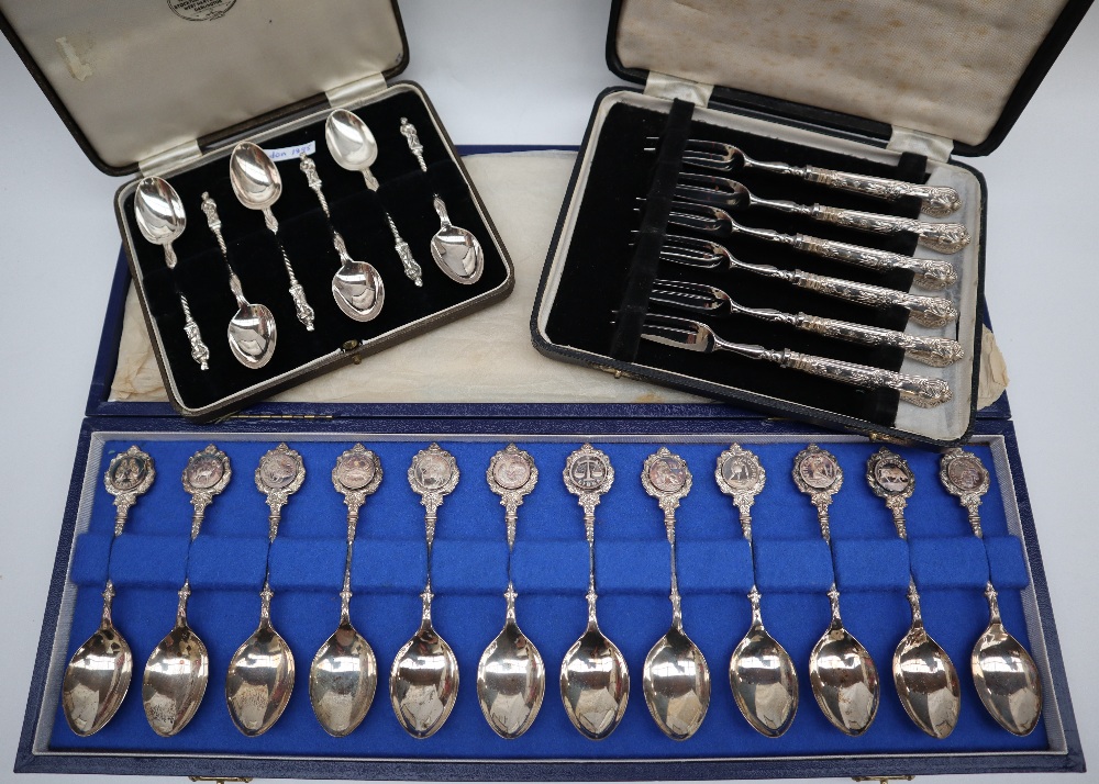 A set of twelve silver zodiac spoons, sculpted by David Cornell by John Pinches, with certificate,