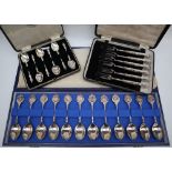 A set of twelve silver zodiac spoons, sculpted by David Cornell by John Pinches, with certificate,