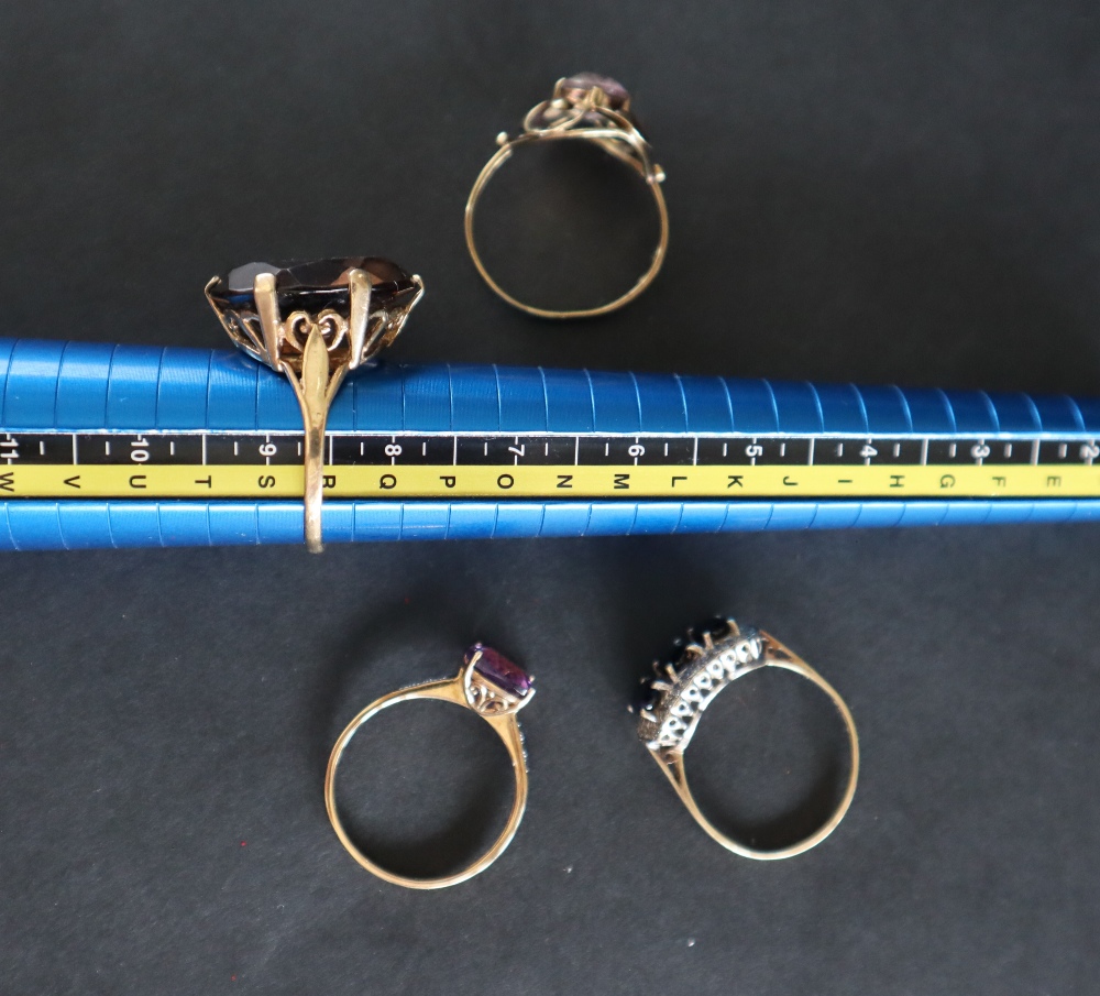 A 9ct yellow gold amethyst set dress ring together with two other 9ct gold rings another ring and - Image 5 of 8