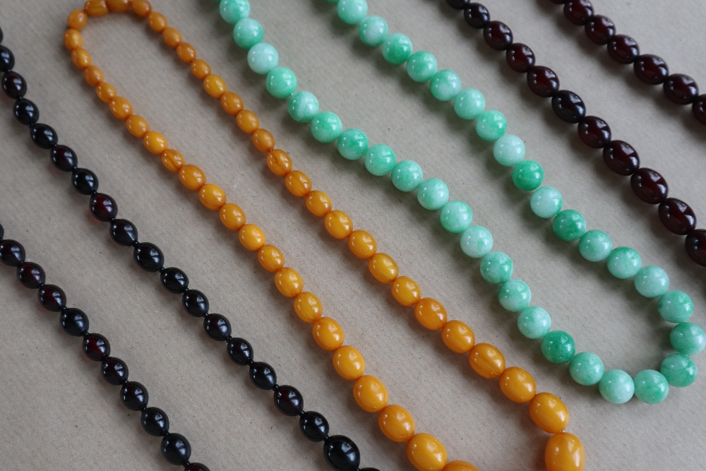 A Cherry amber / bakelite bead necklaces, with oval beads ranging in size from, 23mm to 8mm, - Image 2 of 14