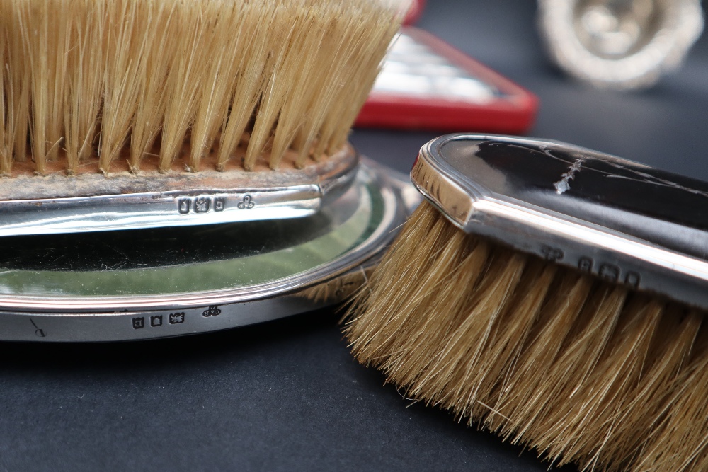 A silver and tortoiseshell mounted hand mirror together with two matching brushes, - Image 3 of 5