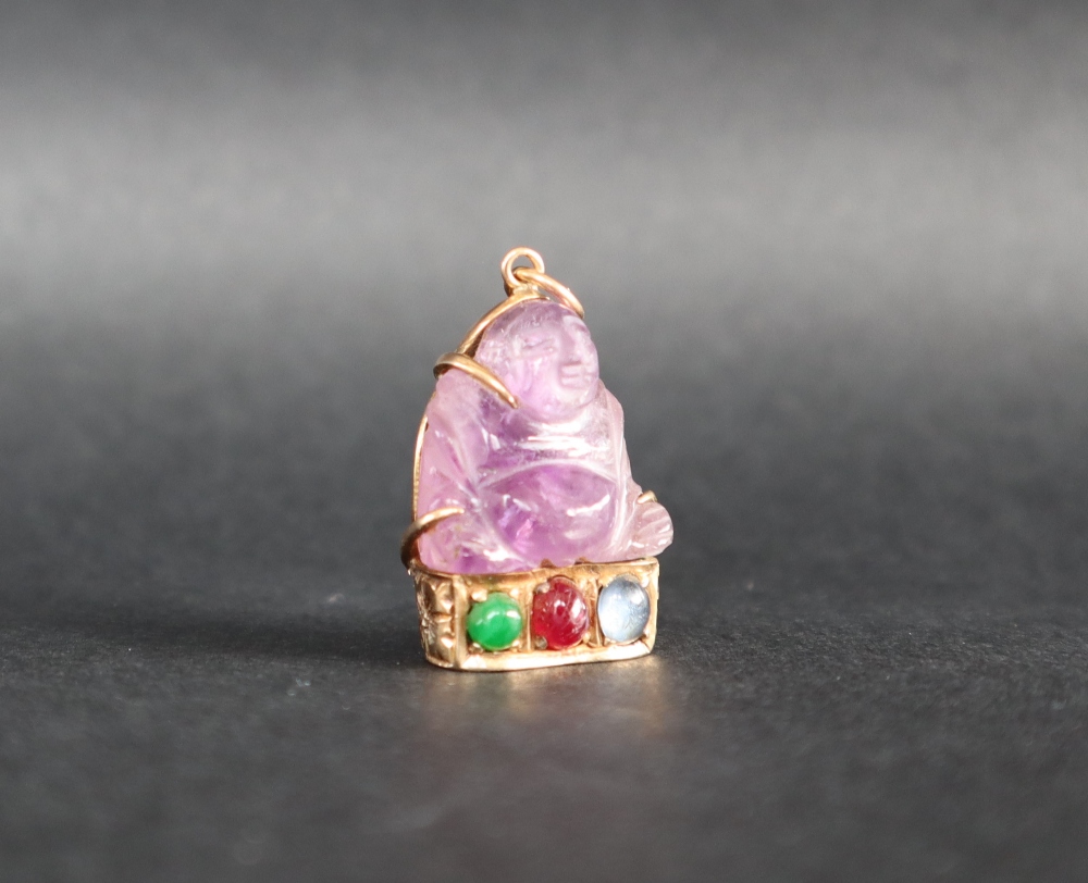 A Chinese amethyst Buddhistic pendant mounted in yellow metal, marked 14k,