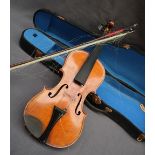 A three quarter size violin, with a two piece back and ebony stringing, bears a label El Tesoro,