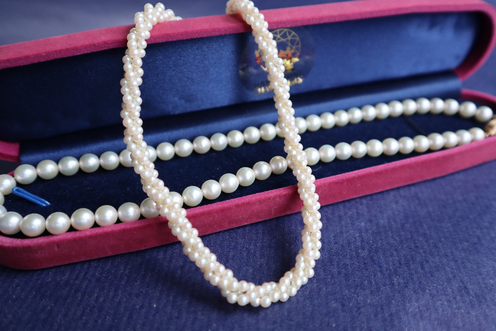 A pearl necklace with fifty nine regular pearls to a 14ct yellow gold oval basket clasp, 42.