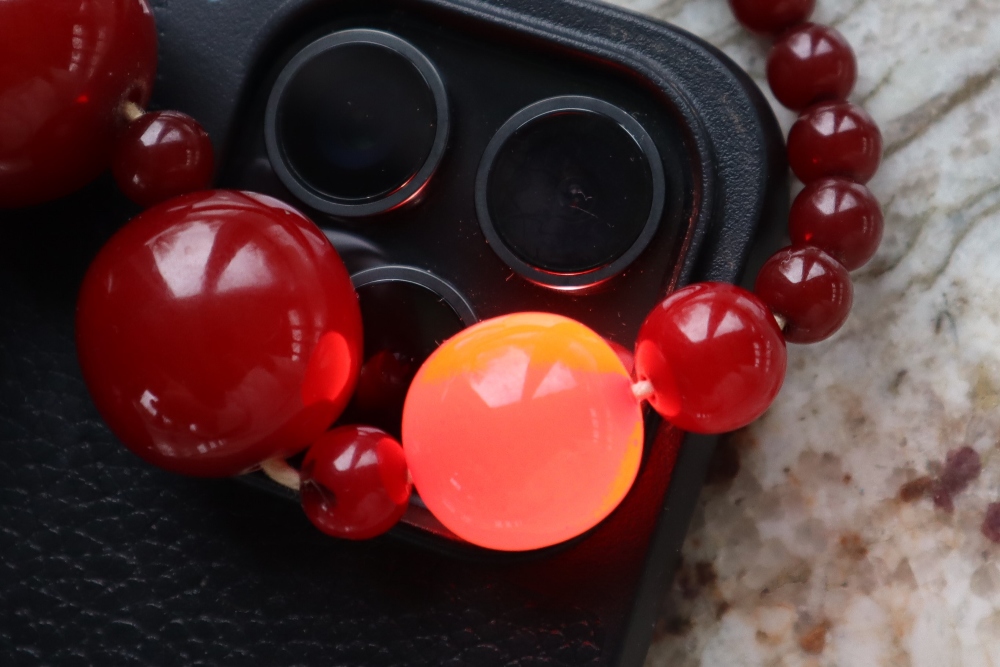 A string of cherry amber / bakelite beads, - Image 9 of 9