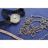 A 9ct gold lady's wristwatch on a fabric strap together with a 15ct gold expanding bracelet strap