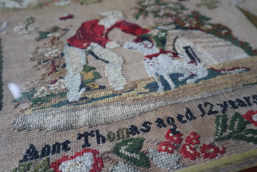 A 19th century woolwork sampler with a flower and leaf border with overall decoration of a cottage, - Image 3 of 4