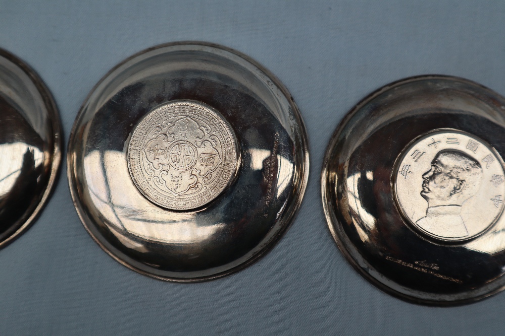 Chinese silver - A set of three Waikee sterling silver pin trays each set with a coin to the base, - Image 5 of 6