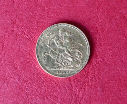 A Victorian young head gold sovereign dated 1885